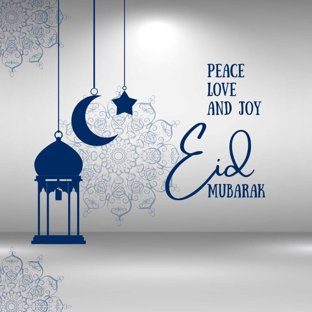 beautiful light grey background with hangings of the blue mosque, moon, and star embossed with a message of eid mubarak